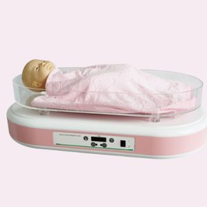 tavolo di rianimazione neonatale con lampada per fototerapia