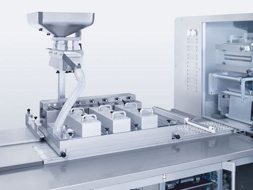 Alimentatore dosatore a vibrazione - Brush Box - Uhlmann - automatico / per l'industria farmaceutica / per compresse
