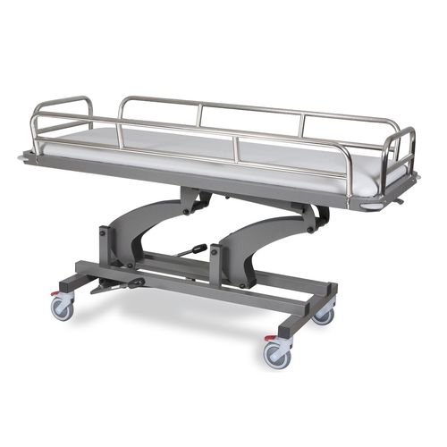 Barella con carrello da trasporto - OPTIMUS CARE 1 JR - Wesseling - idraulica / elettrica / ad altezza regolabile
