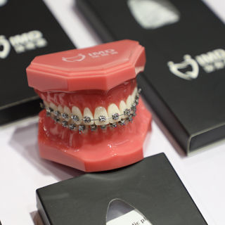 Bracket ortodontici in metallo - ActMIM - Innovative Material and Devices, Inc. - di autolegatura / rettangolare / rotondo