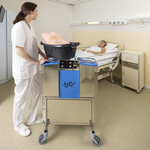 Doccia a letto con rotelle - EVOLUTION - ARCANIA DEPARTMENT SOFINOR - mobile / con pompa / con doccetta