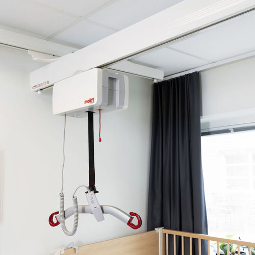 Sollevapersone elettrico - Etac - a soffitto / su guida di scorrimento / per vasca
