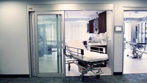 Porta per terapia intensiva - Dura-Care 7500A - Stanley Access Technologies - battente / a vento / automatica