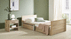 letto per cure domiciliari / elettrico / ad altezza regolabile / con rotelle